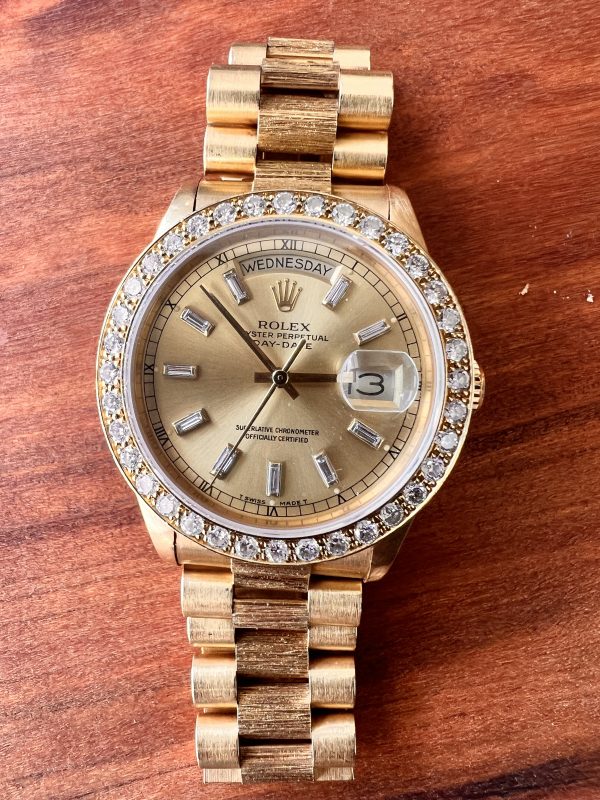 Rolex Day-Date President – 18k Yellow Gold with Diamond Bezel & Baguette Diamond Dial